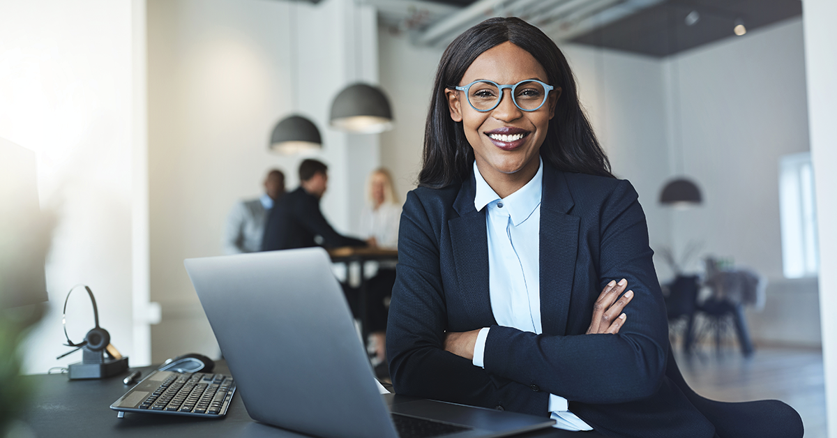 legal intake specialist smiling with her arms crossed