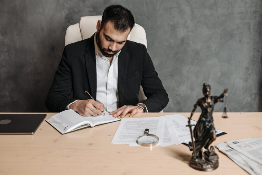 Man writing on desk